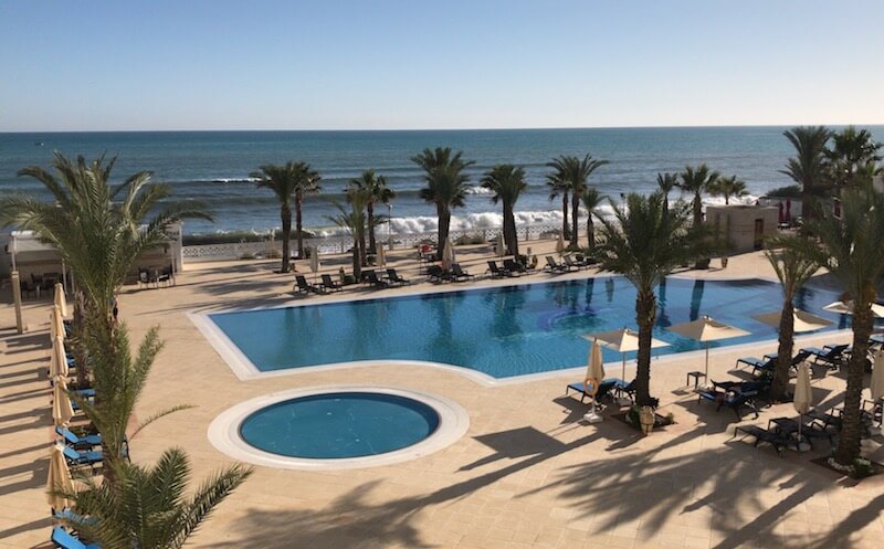 Swimming pool by the seaside in Tunisia - perfect women's travel accommodations