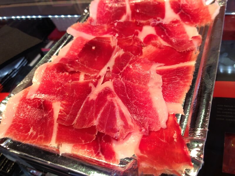 Slices of jamon serrano at the Mercado San Miguel in Madrid