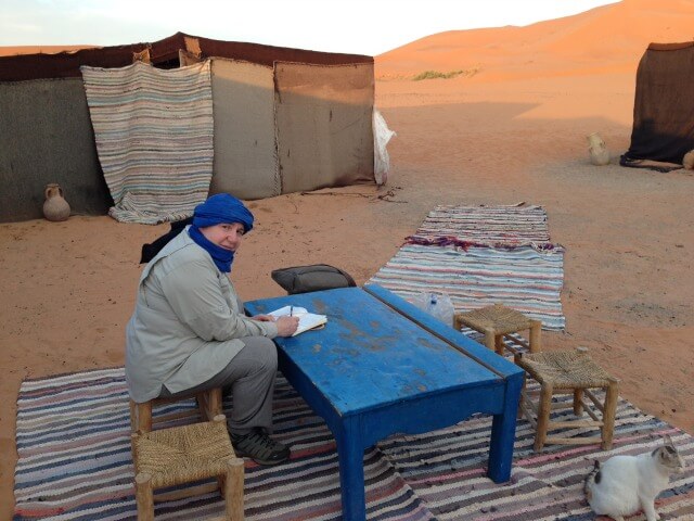 Travel journal ideas - writing things down in the middle of the Sahara Desert
