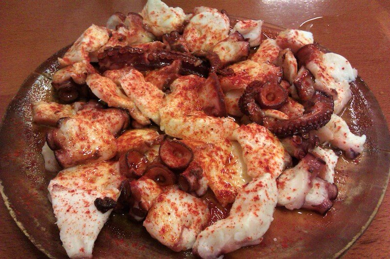 pulpo gallego, one of many hot tapas and typical of almost any tapas bar (Spain)