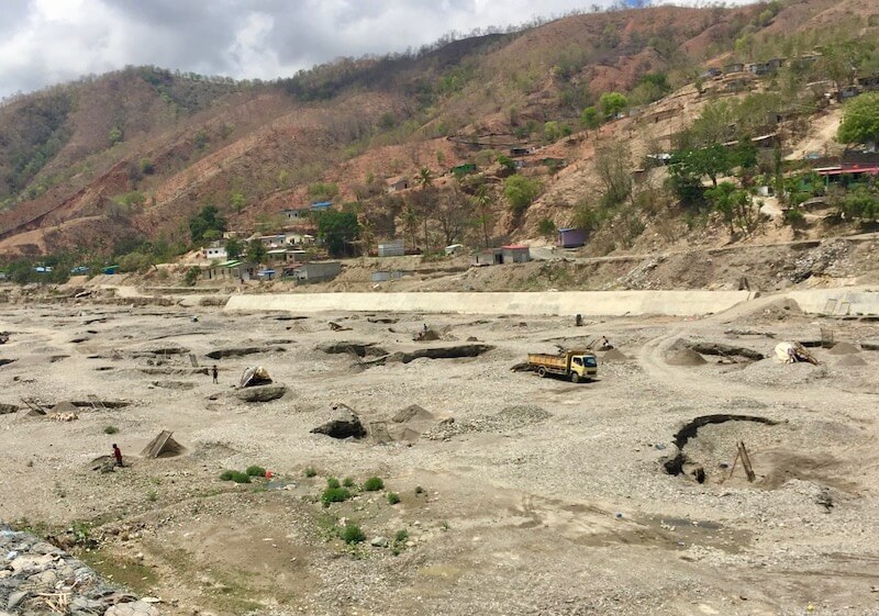 Mining sand in a Dili riverbed