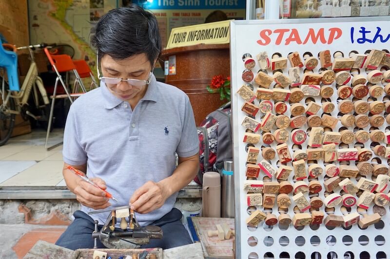 Making various Vietnamese stamps in Hanoi