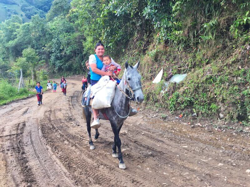 experiential travel: riding down a Colombian mountain with local women