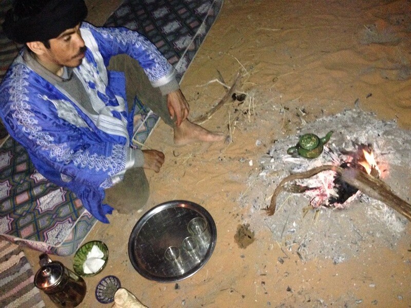 Cooking over a fire in the Sahara desert