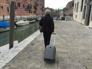 pulling a suitcase with wheels in Venice