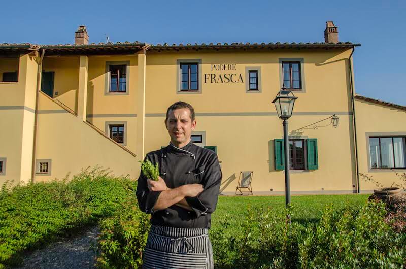 cooking in Tuscany - chef Sunshine posing in front of the school